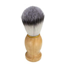 Shaving brush with wooden handle and synthetic bristles on a white background